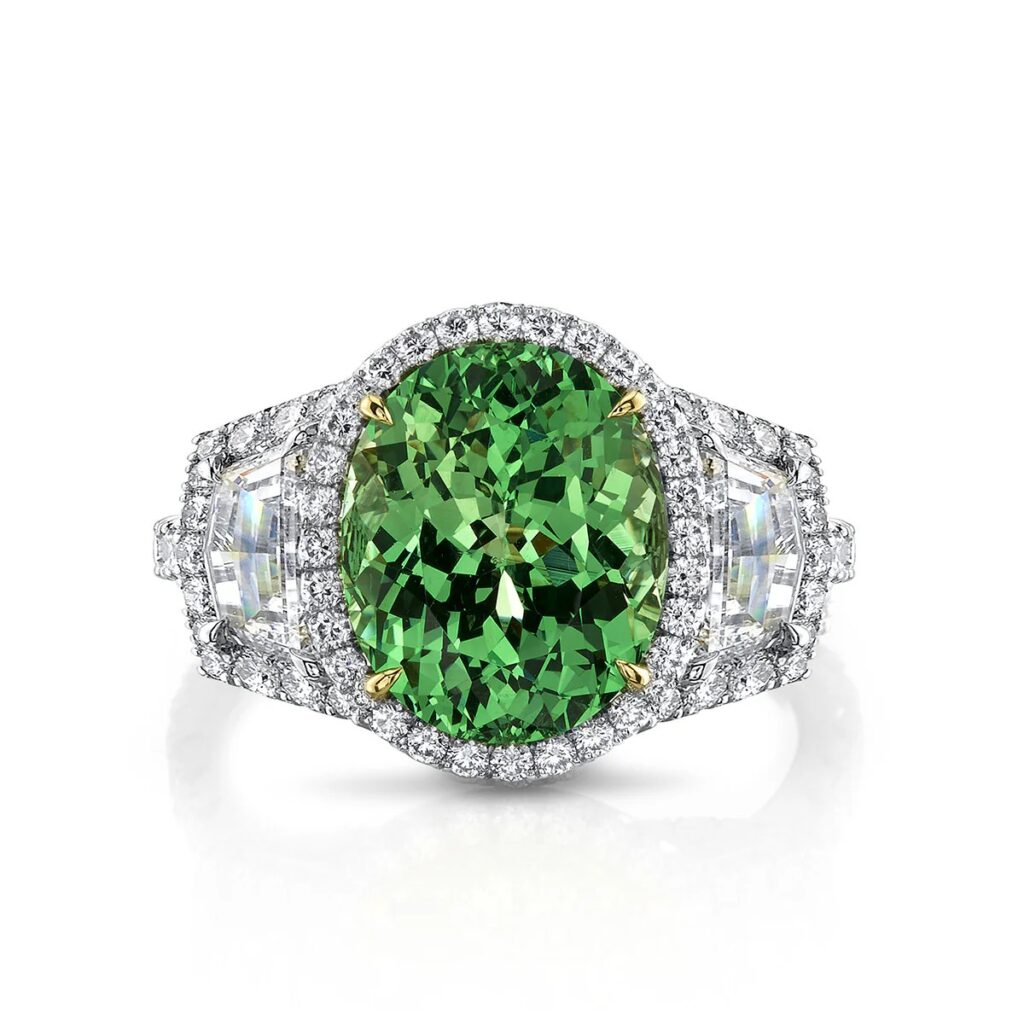 A high-end jewelry piece featuring a brilliant green Tsavorite garnet set in precious metal, showcasing its use in modern jewelry design.
