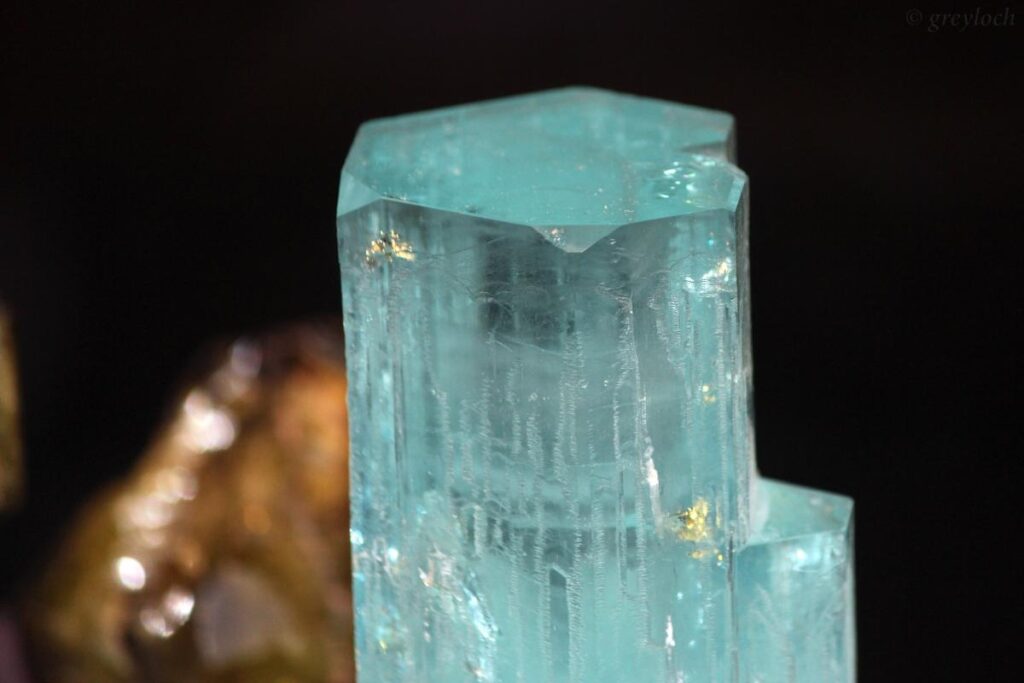 High-clarity, faceted Beryllium Glass gemstone, displaying a vibrant, saturated cyan-blue hue designed to mimic the appearance of premium natural aquamarine.