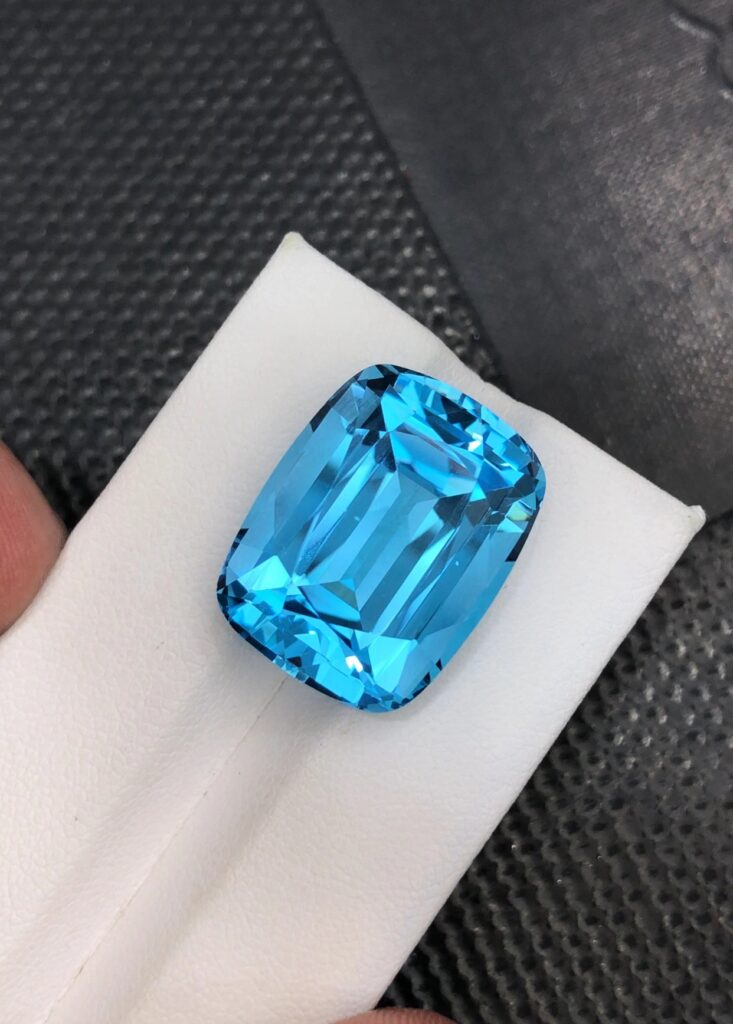 Precision-cut, rectangular Cristinite™ gemstone showcasing a vibrant, saturated blue hue and exceptional clarity, designed to simulate the appearance of natural blue gemstones.