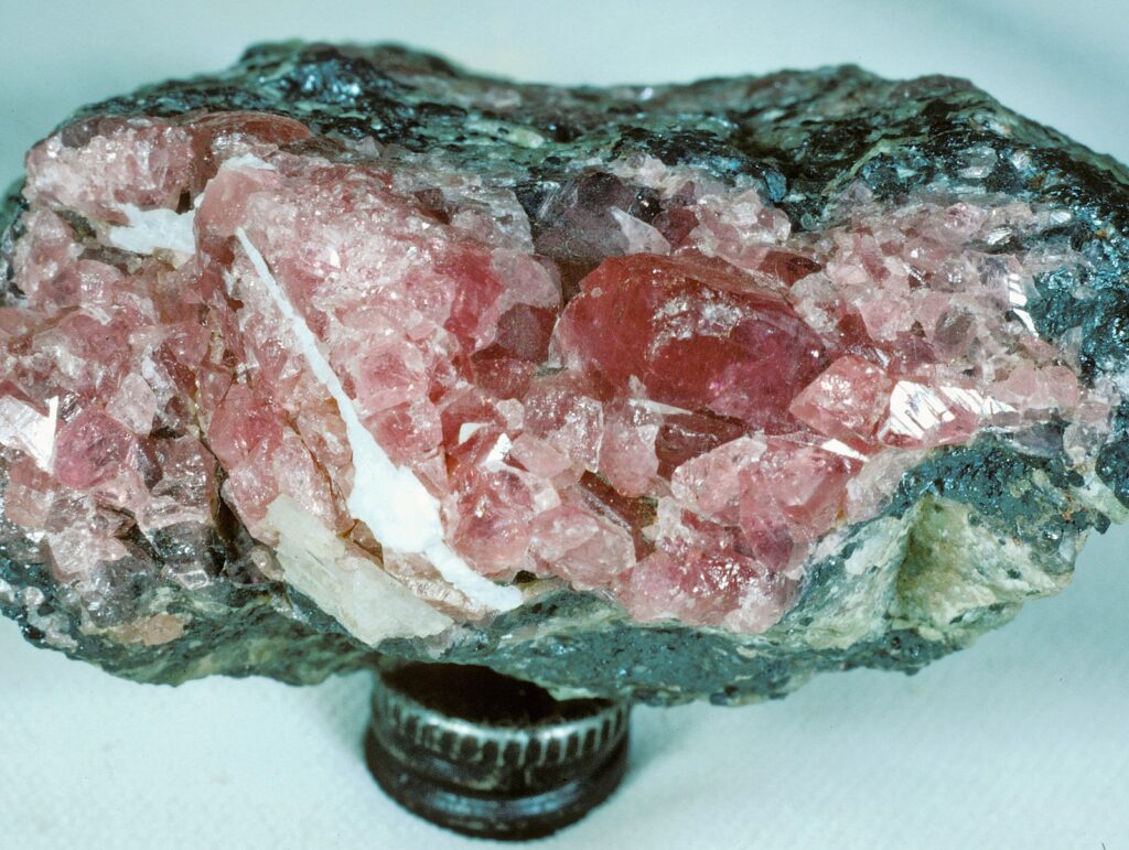 Hodgkinsonite Franklin, Sussex County, New Jersey, USA Hodgkinsonite. Specimen is from the collection of Ewald Gerstmann (1972). Specimen is ~4cm wide.