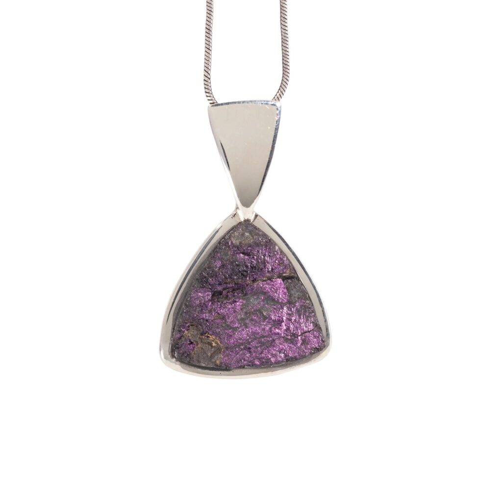 Purpurite utilized in artisan jewelry.