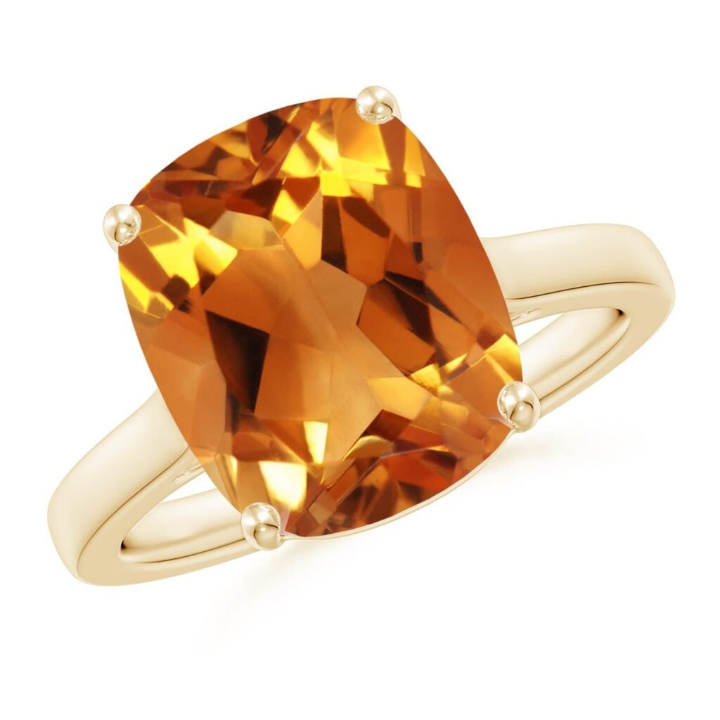Pierre précieuse en citrine dorée facettée, sertie dans une bague en or